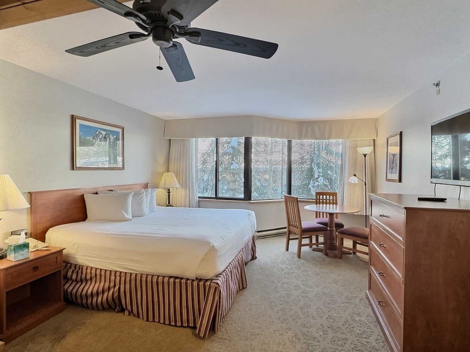 King Bed and Dining Area | Listed with @BookTraverse