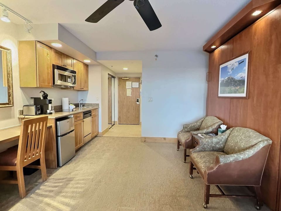 Kitchenette, Sitting Area and Comfortable Murphy Bed | Listed with @BookTraverse