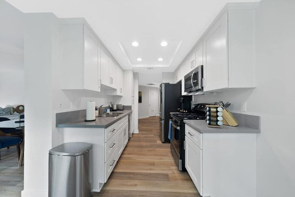 Clean, white cabinetry and spacious counters for easy meal prep.