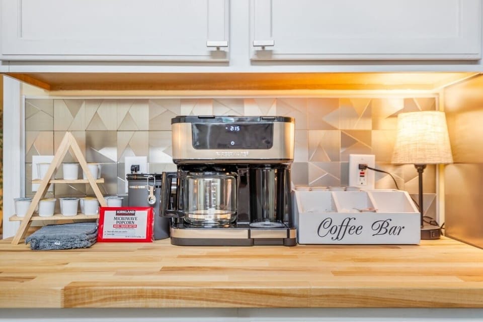 Fully stocked coffee bar with ground coffee, k-cups, and tea. You can find sugar and creamer as well! 