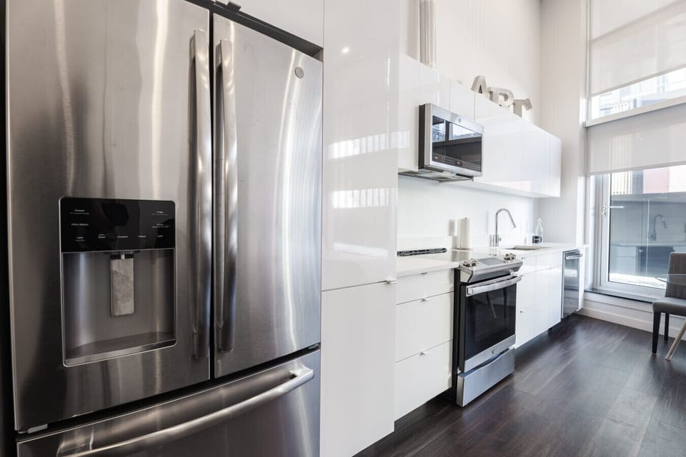 Cook with Elegance – Contemporary Kitchen Featuring High-End Appliances.