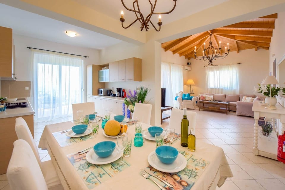 Dining table with kitchen and living room