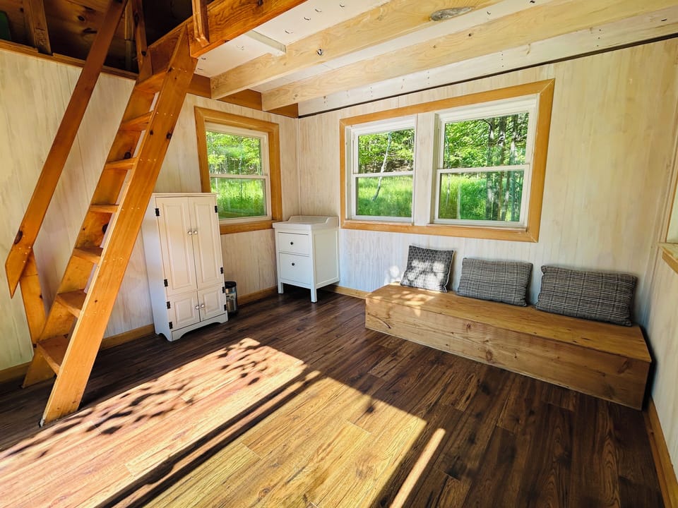 Kids and adults alike will love the tiny house with play area and sleeping loft