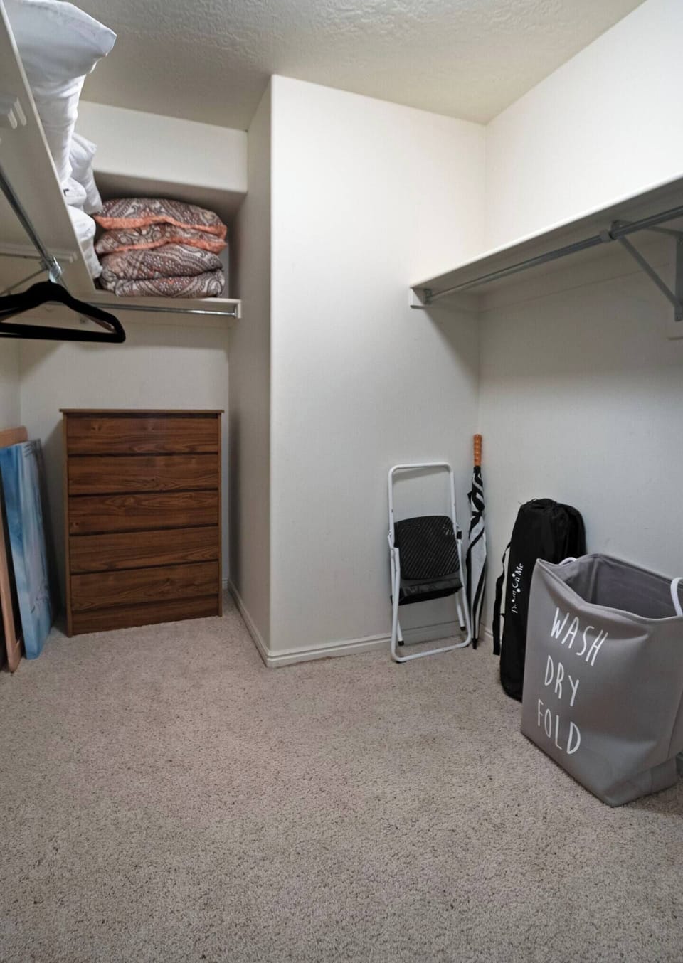 The walk in closet of the primary bedroom