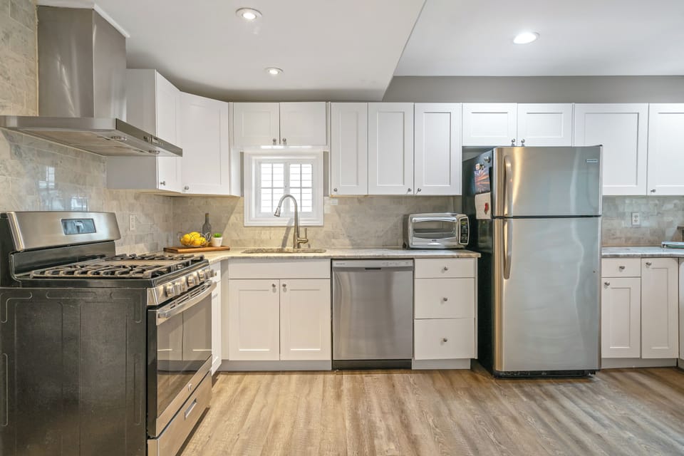 Stainless steel appliances including gas stove and dishwasher 