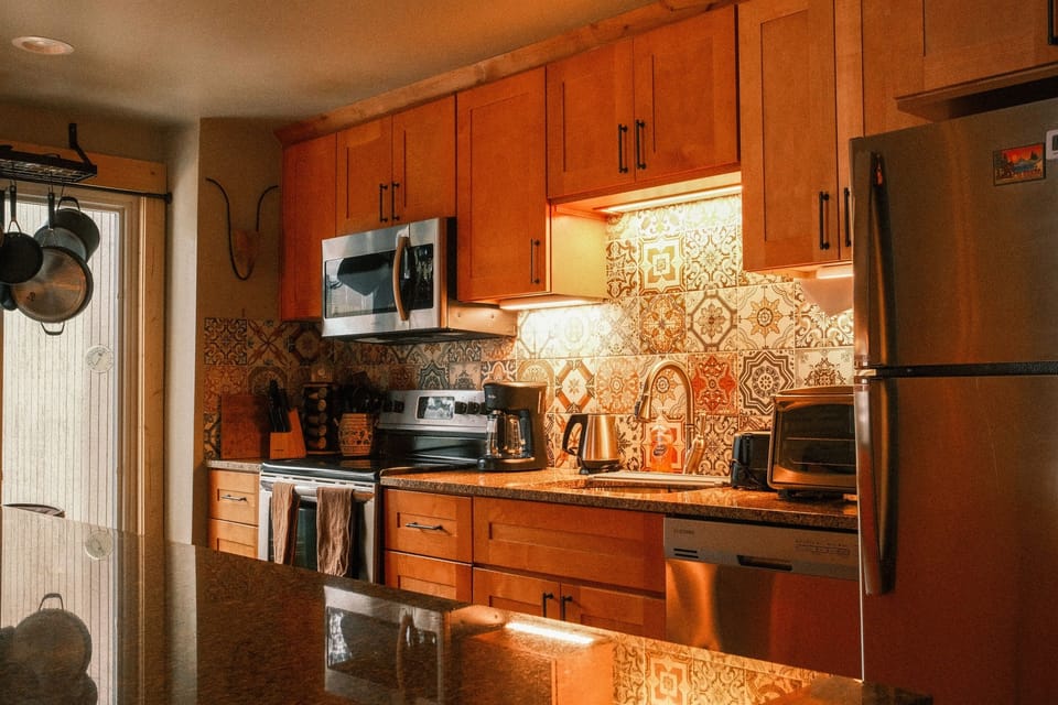 Fully equipped kitchen overlooks the spacious living space.