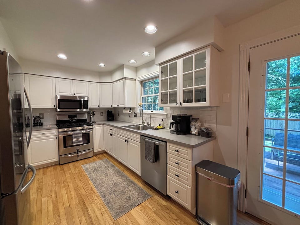 Fully stocked kitchen with place settings for 12.