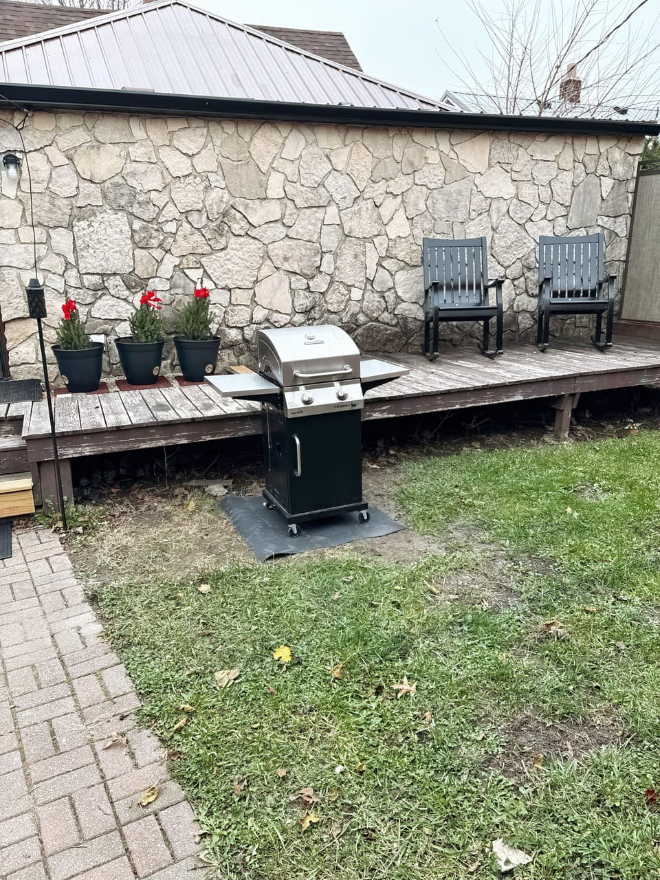 Propane grill, grilling utensils available.