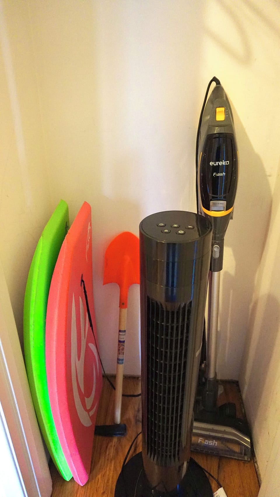 Standing fan, vacuum, and beach equipment -- all here for you