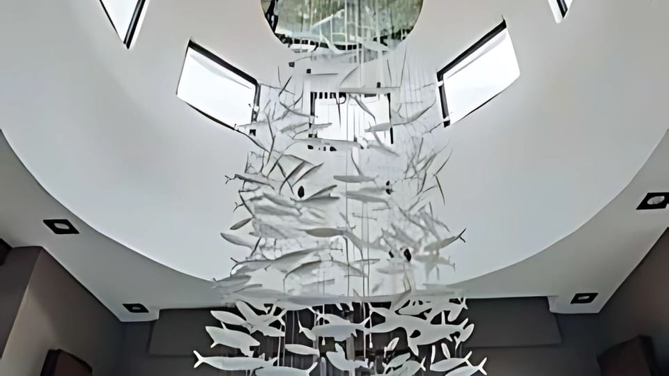 Vista Encantada's soaring atrium with marine-inspired chandelier


