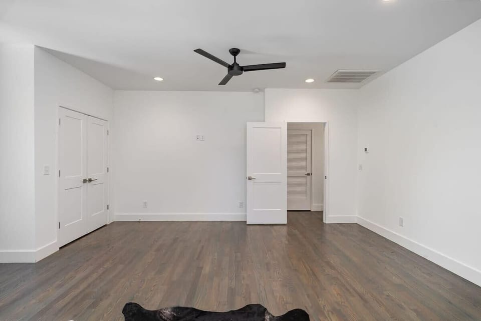 The 2nd bedroom, located on the 3rd floor, is furnished with two full beds, offering a cozy retreat.