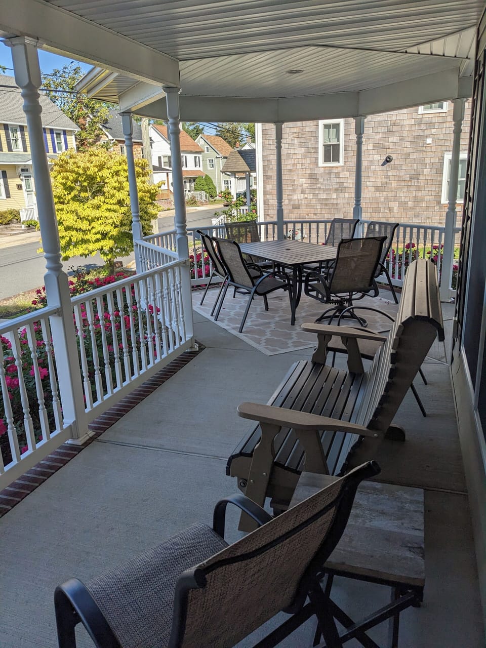 front porch with rocker and large table