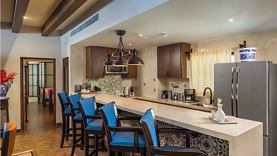 Vista Encantada gourmet kitchen with high-end finishes and backsplash

