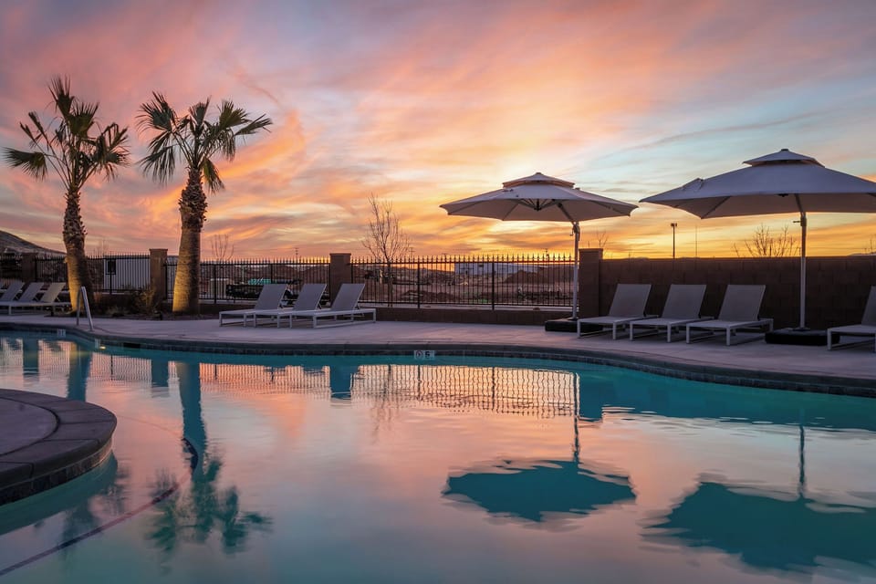 Sunset paints the sky as the lazy river shimmers in the evening glow