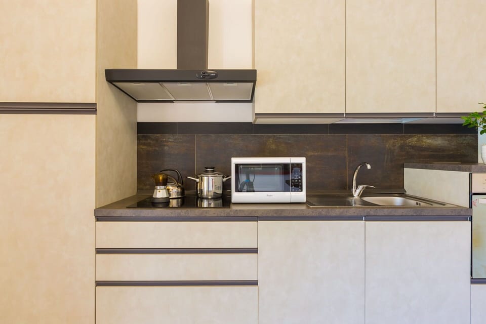 Kitchen, Countertop, Kitchen Appliance, Cabinetry, Interior Design, Wood, Furniture, Major Appliance, Flooring, Home Appliance
