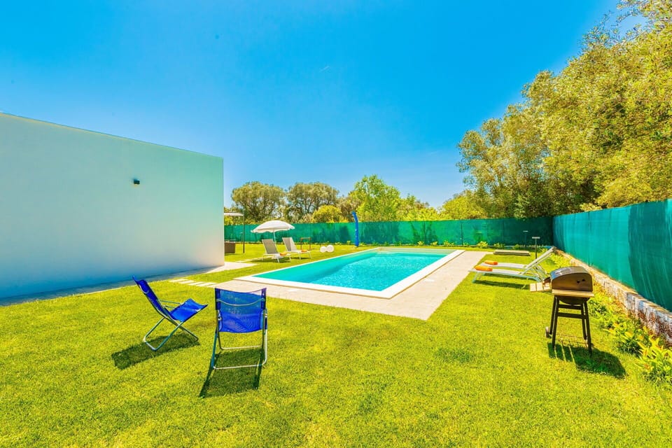 Blue, Swimming Pool, Lawn, Artificial Turf, Landscaping, Shade, Design, Resort, Backyard, Hotel