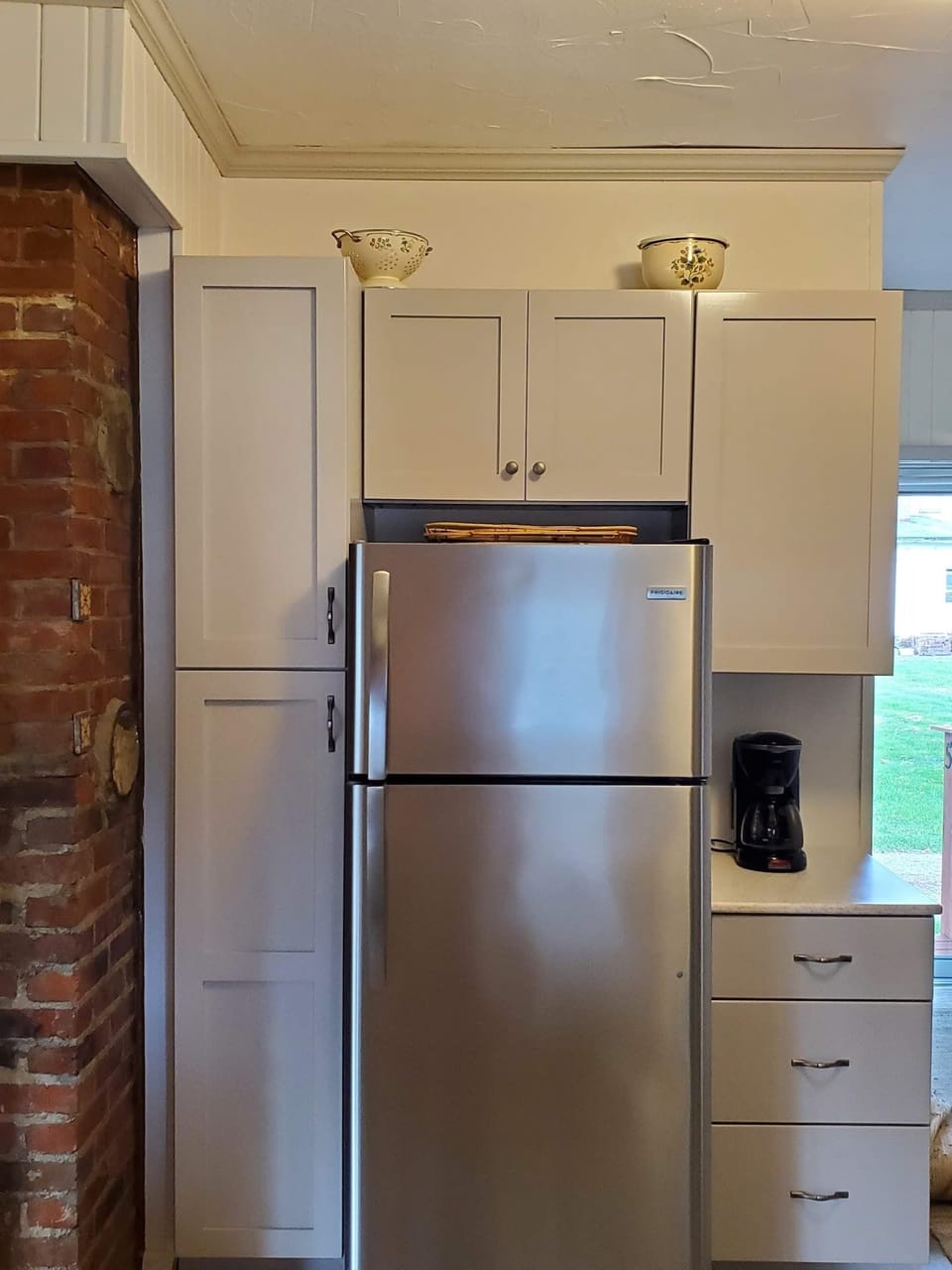 Kitchen with refrigerator and pantry storage