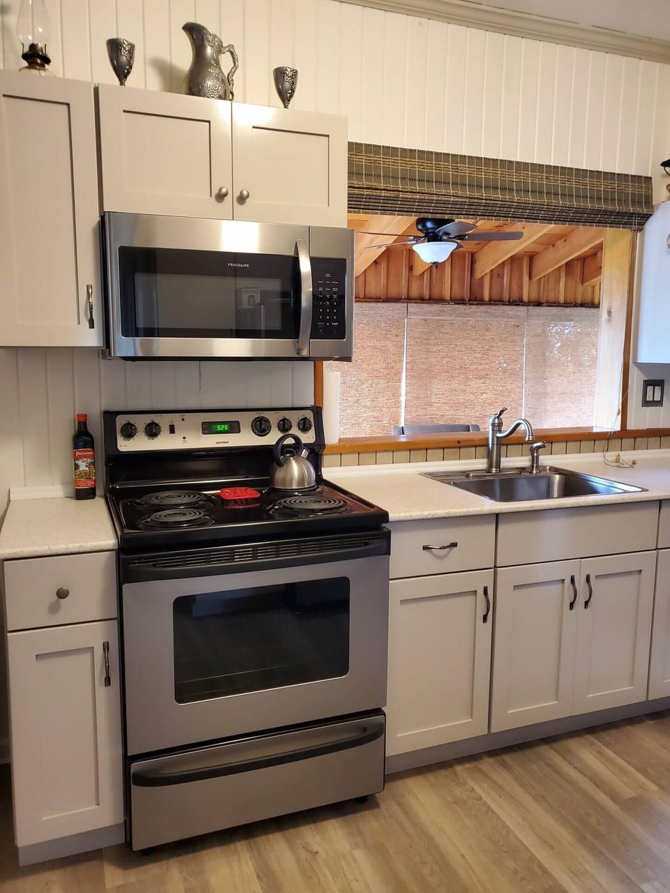 Kitchen area with stainless steel appliances. Fully supplied, with room for your own shopping and pantry items!