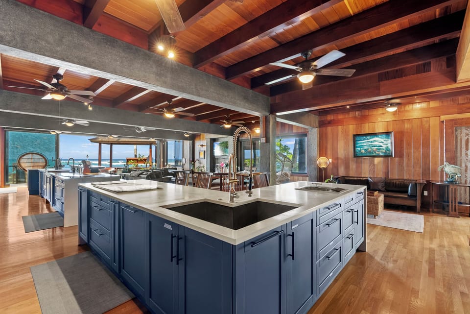 Prepare memorable meals in the gourmet chef's kitchen featuring professional-grade appliances, oversized islands, and spectacular ocean views.