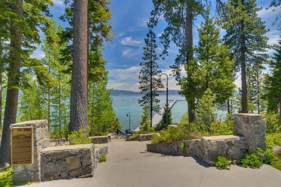 Main Meadow with staircase to lakefront pool, beach and pier