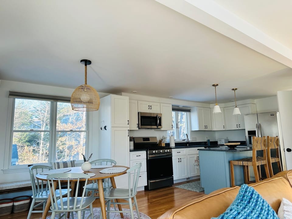 Step through the sliding glass door into a bright and airy open-concept space.