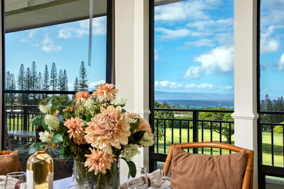 Sip your morning brew or sunset cocktail on this charming lanai—where the golf greens glow and skies stretch forever    