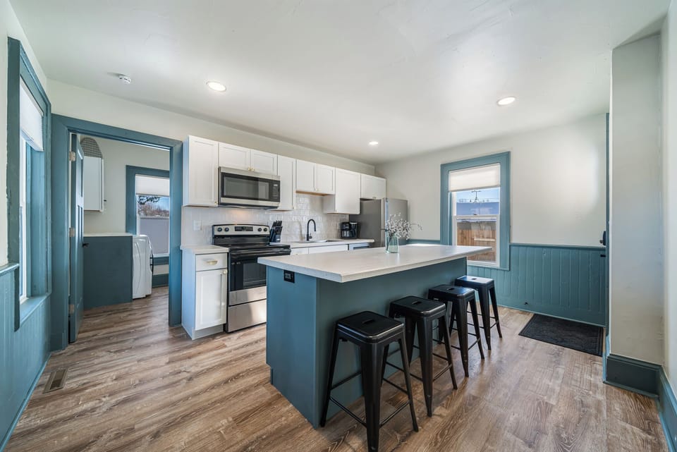 - Contemporary kitchen design with bar seating for four guests   - Fully equipped with modern appliances and stylish finishes   - Perfect place to gather for meals and morning coffee moments