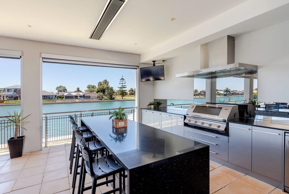 Outdoor Kitchen - complete with: BBQ, fridge, sink, TV, LIV Golf