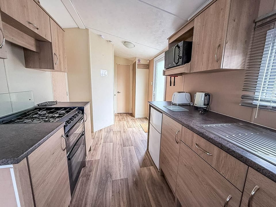 This communal space is the heart of your holiday retreat, allowing the whole family to be together whether you're cooking a meal, enjoying dinner, or relaxing on the sofa after a day of adventure in Hunstanton.