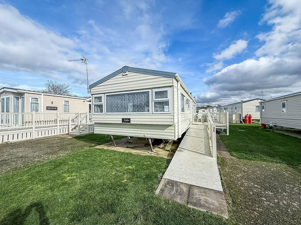 Escape to this 6 berth caravan with decking, located on Manor Park Holiday Park, Hunstanton for a delightful seaside break, perfect for short stays and memorable family holidays.