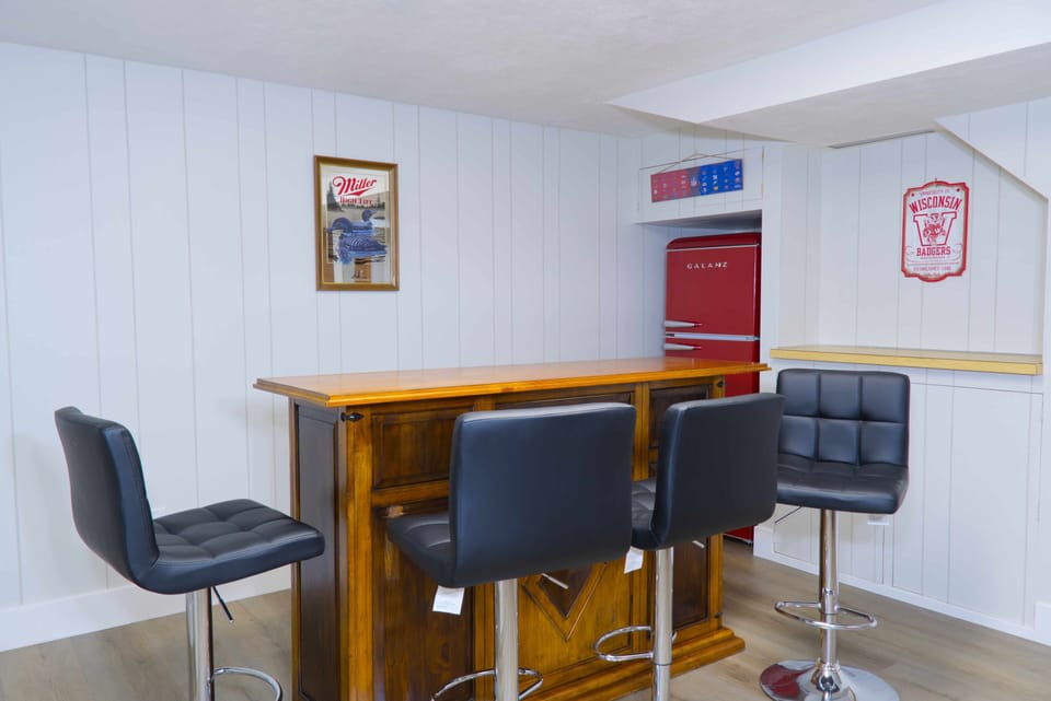Basement Pool Room with 75in TV, Fridge, and Bar