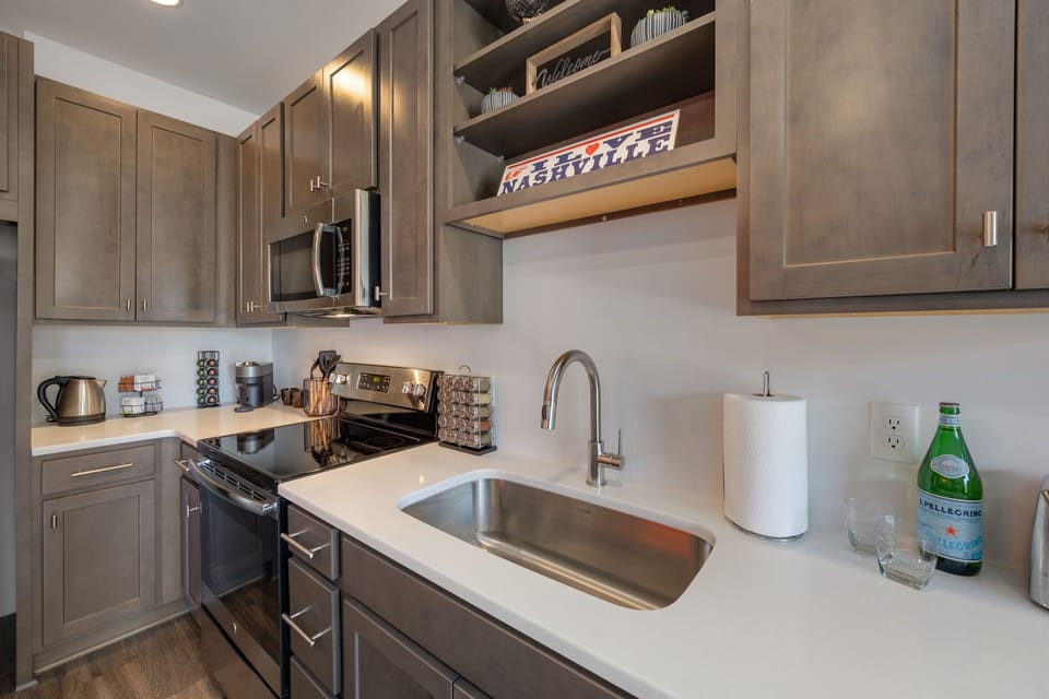 Stylish kitchen sink area with thoughtful modern finishes.