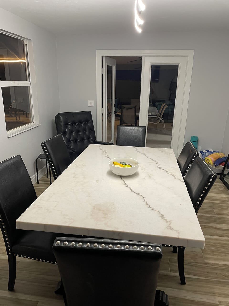 French doors lead out to the pool area.