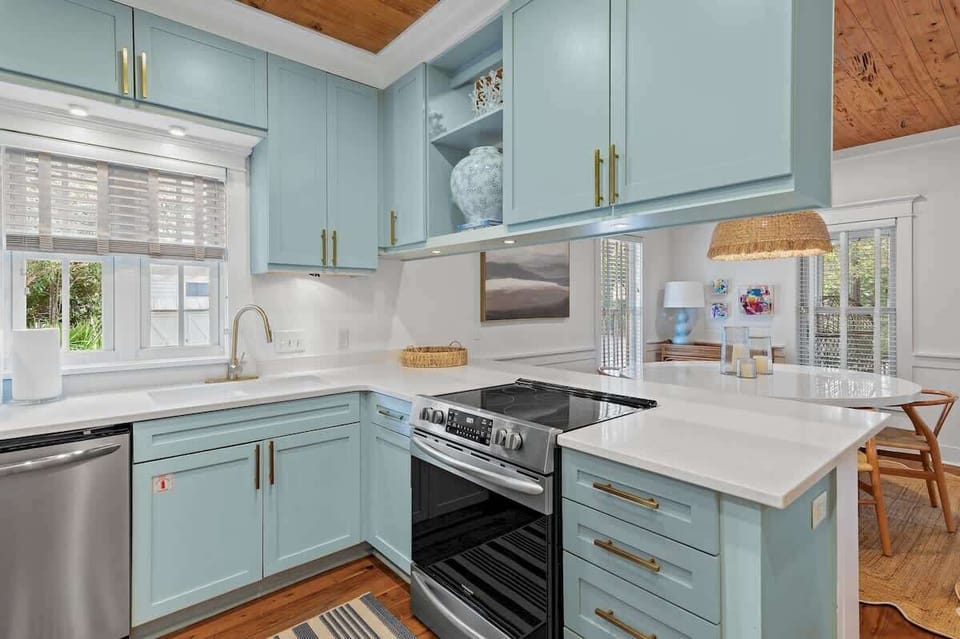 Kitchen: Drip coffee maker, Keurig, cooking utensils, blender, tableware