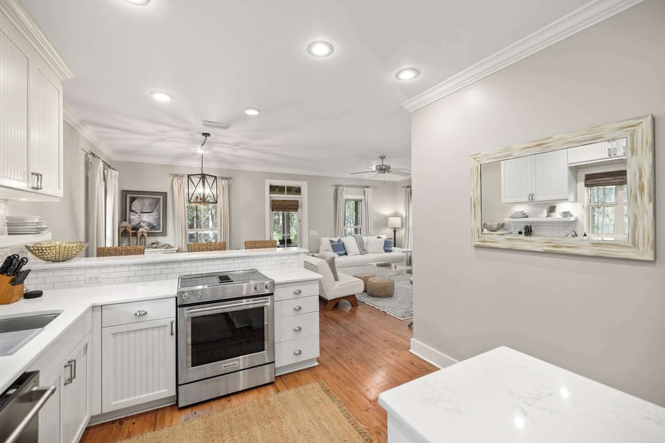 Kitchen: Stainless steel appliances, drip coffee maker, cooking utensils, tableware