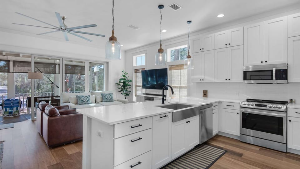 Kitchen: Drip coffee maker, Keurig, blender, toaster oven, waffle maker, cooking utensils, tableware