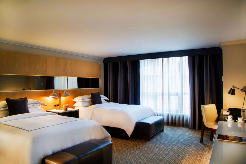 Unit with 2 Queen beds. Exact unit will be assigned upon arrival. Views, colors, and decor may vary.