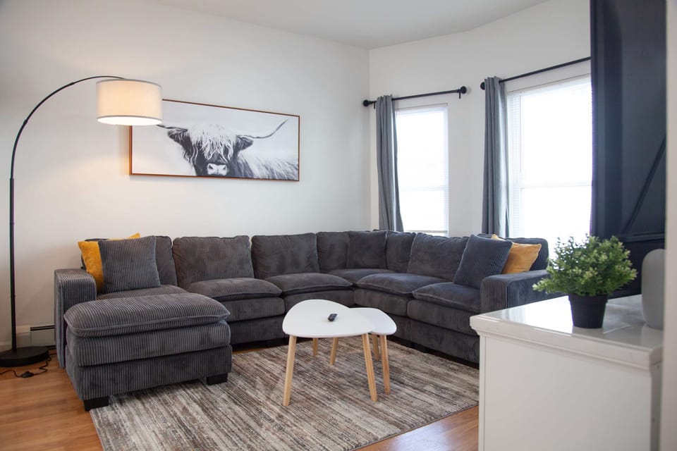 Main Living Room with plush sectional and Smart TV
