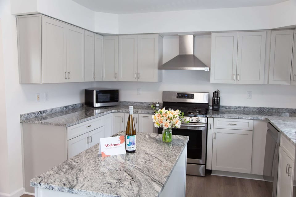 Kitchen- Bright and updated kitchen space with ample prep area and natural light.