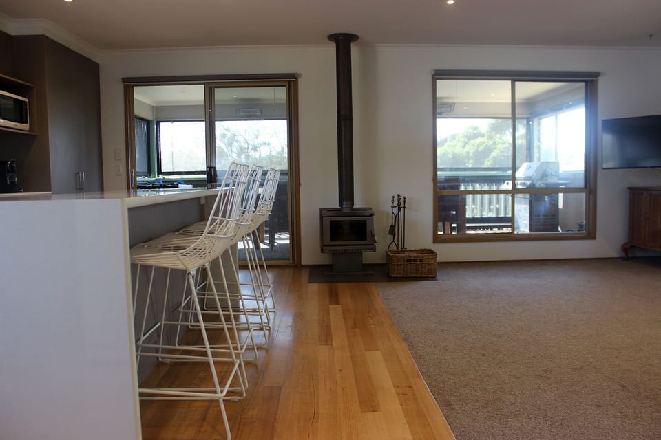 Looking at the living area, kitchen and enclosed outdoor area