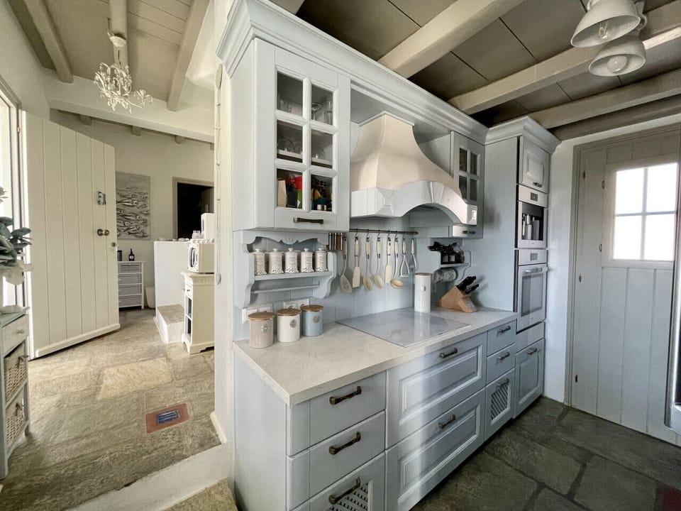 Modern kitchen with foyer in background