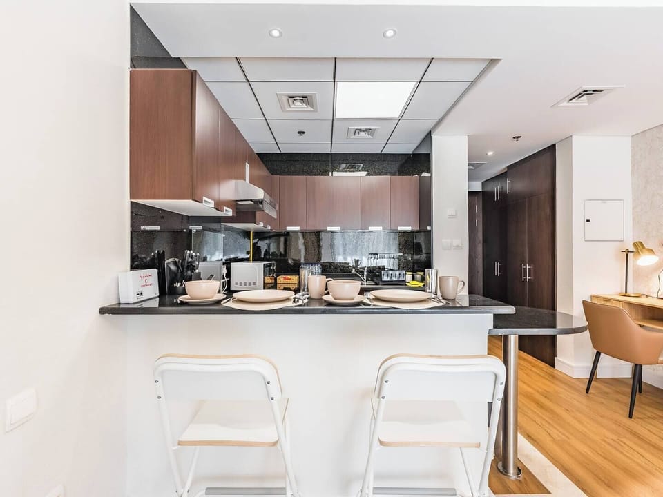 A trendy bar-style dining space highlighted by cozy, standout chairs that seamlessly merge usability with welcoming elegance.