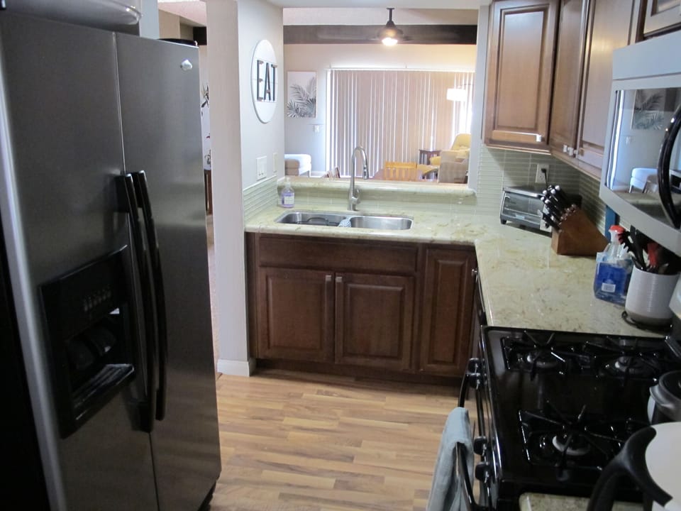 Filtered water and ice machine in the large fridge. 