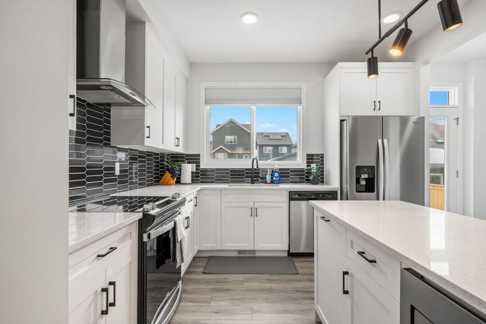 Main floor full kitchen with a drip & Keurig coffee maker, blender & rice cooker.