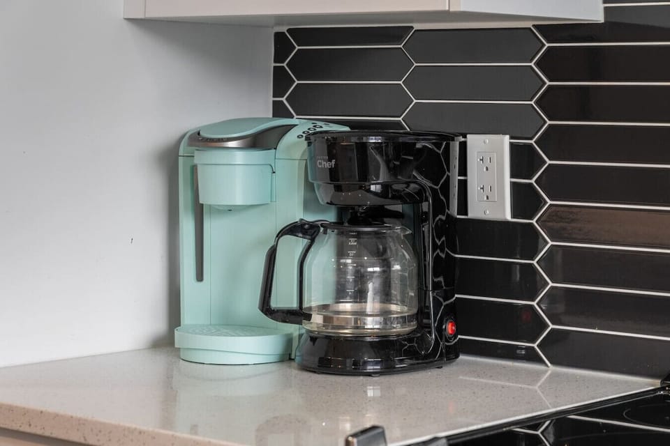 Main floor full kitchen with a drip & Keurig coffee maker, blender & rice cooker.