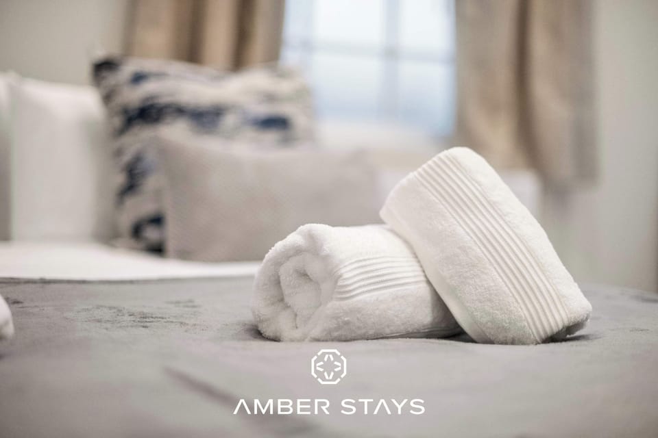 A peaceful bedroom designed for rest and relaxation, with soft bedding and a calm atmosphere that invites you to unwind after a long day.
