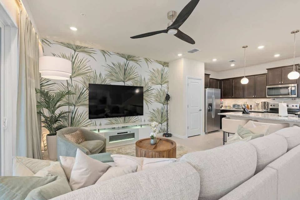 Open concept Living Room sectional sofa, Karaoke, and 75” 4K Smart TV