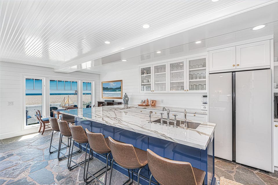 Inviting kitchen island with barstool seating for 10 perfect for casual meals or morning coffee
                