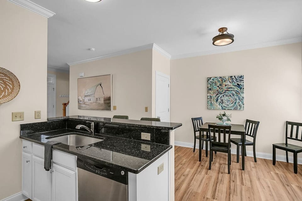 Enjoy an open and conversational floor plan that seamlessly connects the kitchen to the dining area, perfect for keeping guests and family engaged.