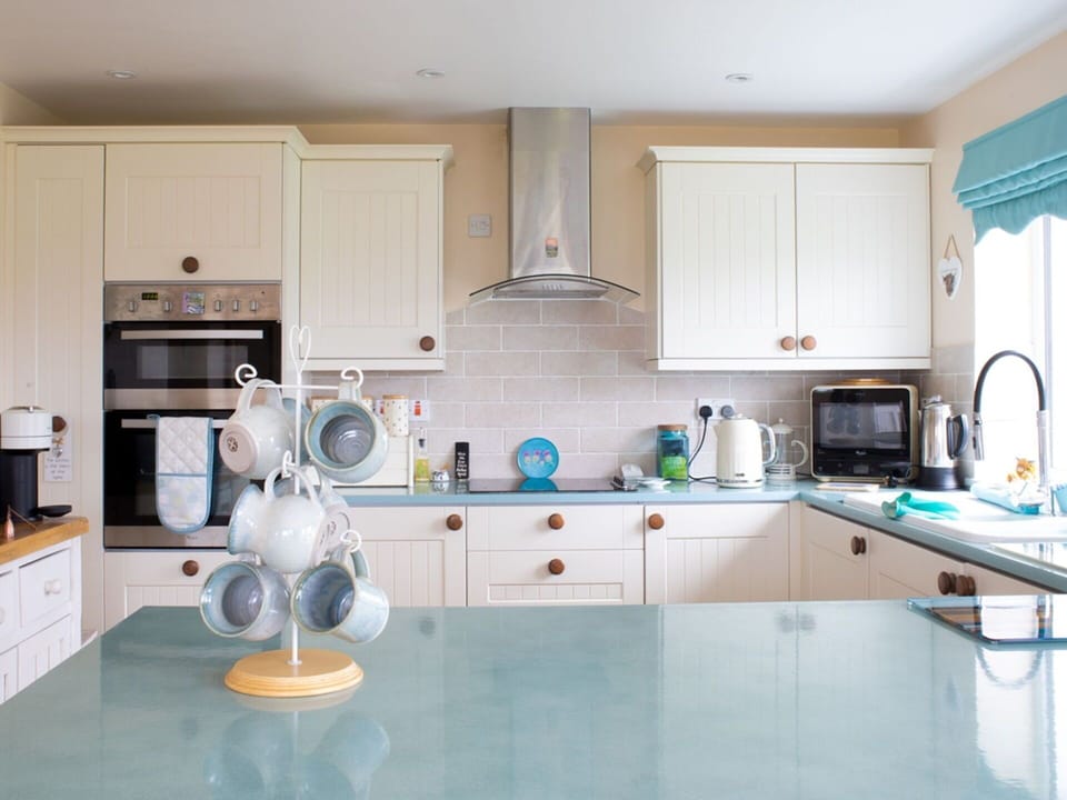 Kitchen, Countertop, Kitchen Appliance, Interior Design, Cabinetry, Flooring, Major Appliance, Furniture, Lighting, Ceiling